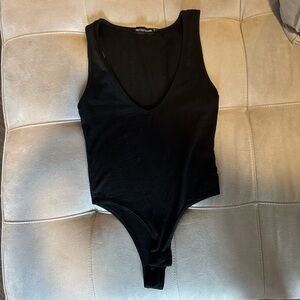 pretty little thing black body suit with vneck
